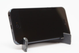 The iPhone stand with the phone, shown at an angle.